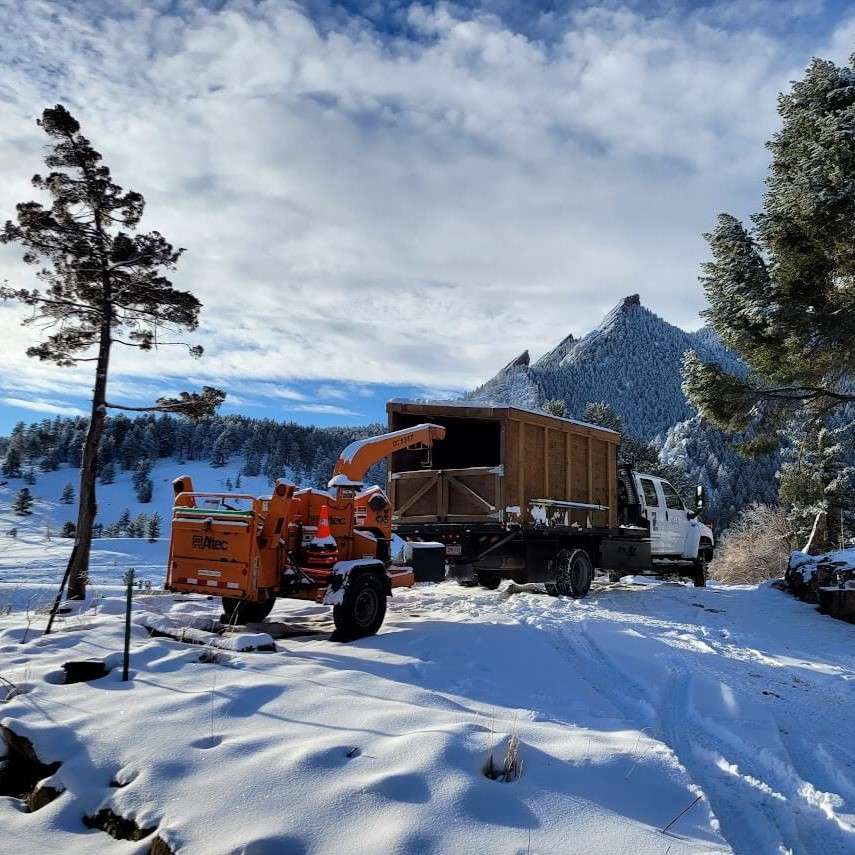 Construction equipment in snowy mountain landscape.